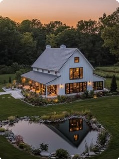 Barn-style home beside a reflective pond