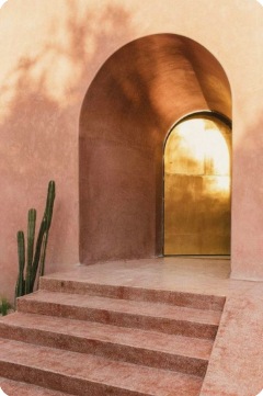 Rounded clay entry with warm light
