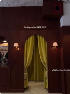 Deep timber coffee bar with a sculptural curtain