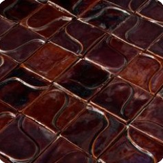 Deep red glazed tile with a handmade surface