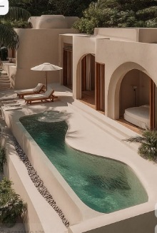 Sculptural courtyard pool framed by arches